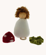 A Nanchen Toadstool Lullaby Music Doll shown with its hat and collar removed. A musical Waldorf doll, made from organic cotton and sheep's wool. 