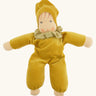 Nanchen Natur Nani Waldorf doll in gold  with a spotty collar that can be removed.