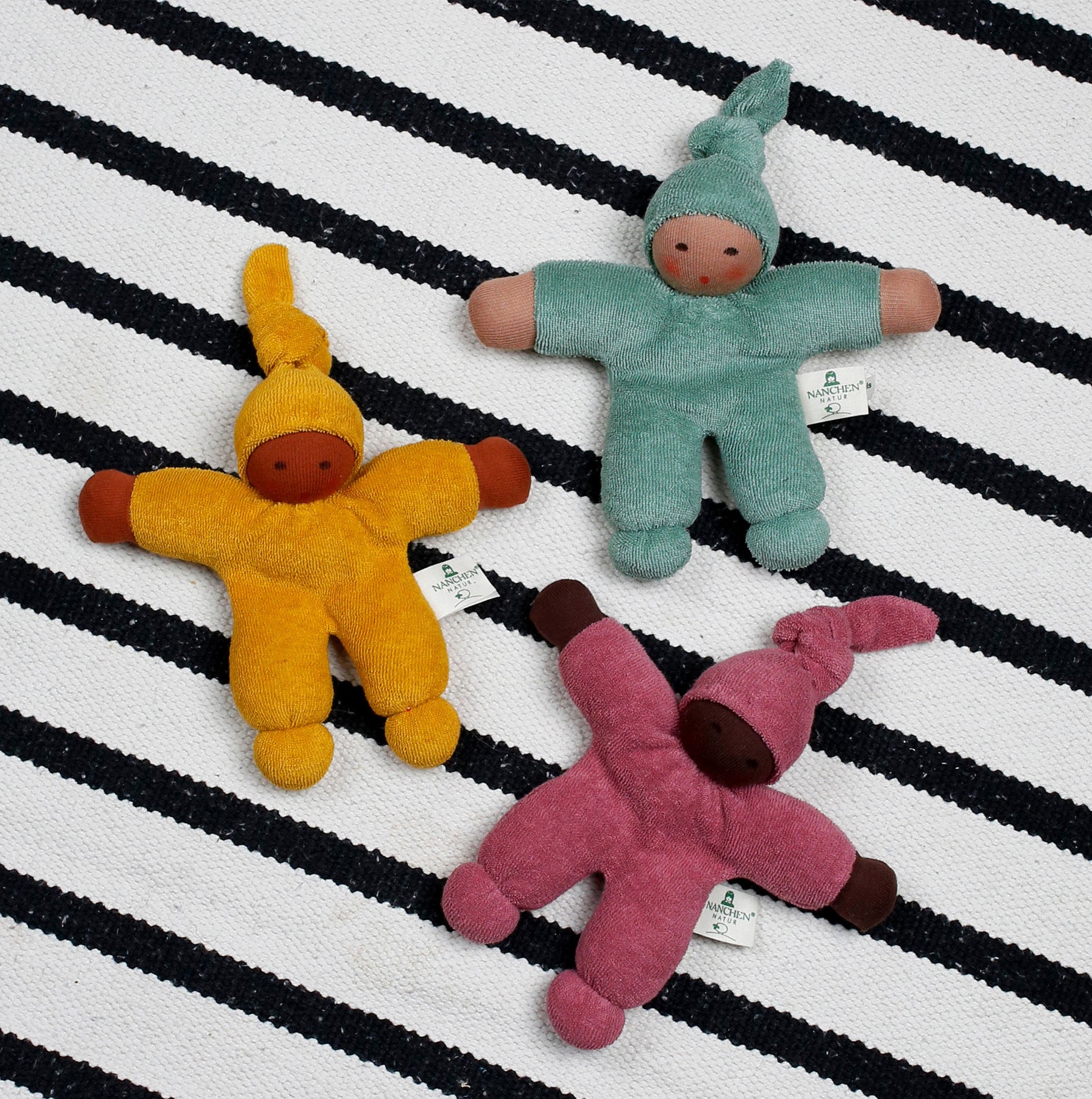 Three Waldorf style organic Pimpel dolls by Nanchen Natur, stuffed with natural sheep's wool. 