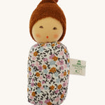 Nanchen Oak Baby Waldorf Doll - Floral. A little organic grasping doll in a floral swaddle on a cream background.