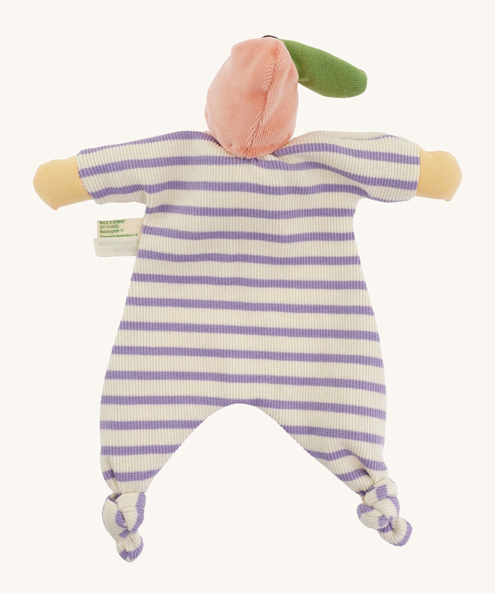 Back view of the Nanchen Peach Baby Comforter, showcasing the soft pink velour fruit hat with a green leaf, and the lilac and white striped cotton terry body with knotted feet and yellow hands.