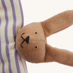 A closeup of The Nanchen organic rabbit baby comforter, with cute stitched bunny features