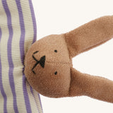 A closeup of The Nanchen organic rabbit baby comforter, with cute stitched bunny features