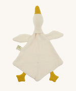 Bottom view of the Nanchen White Goose Baby Comforter, showing its unstuffed, diamond-shaped blanket body made from organic cotton terry. The soft goose head and wings extend from the top, with mustard yellow feet and beak.