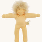 Front view of the Nanchen Frederik organic Waldorf doll with pale skin and fluffy blond mohair hair. The hand-painted face includes subtle blush and red lips. The doll is shown unclothed to highlight its handcrafted body.