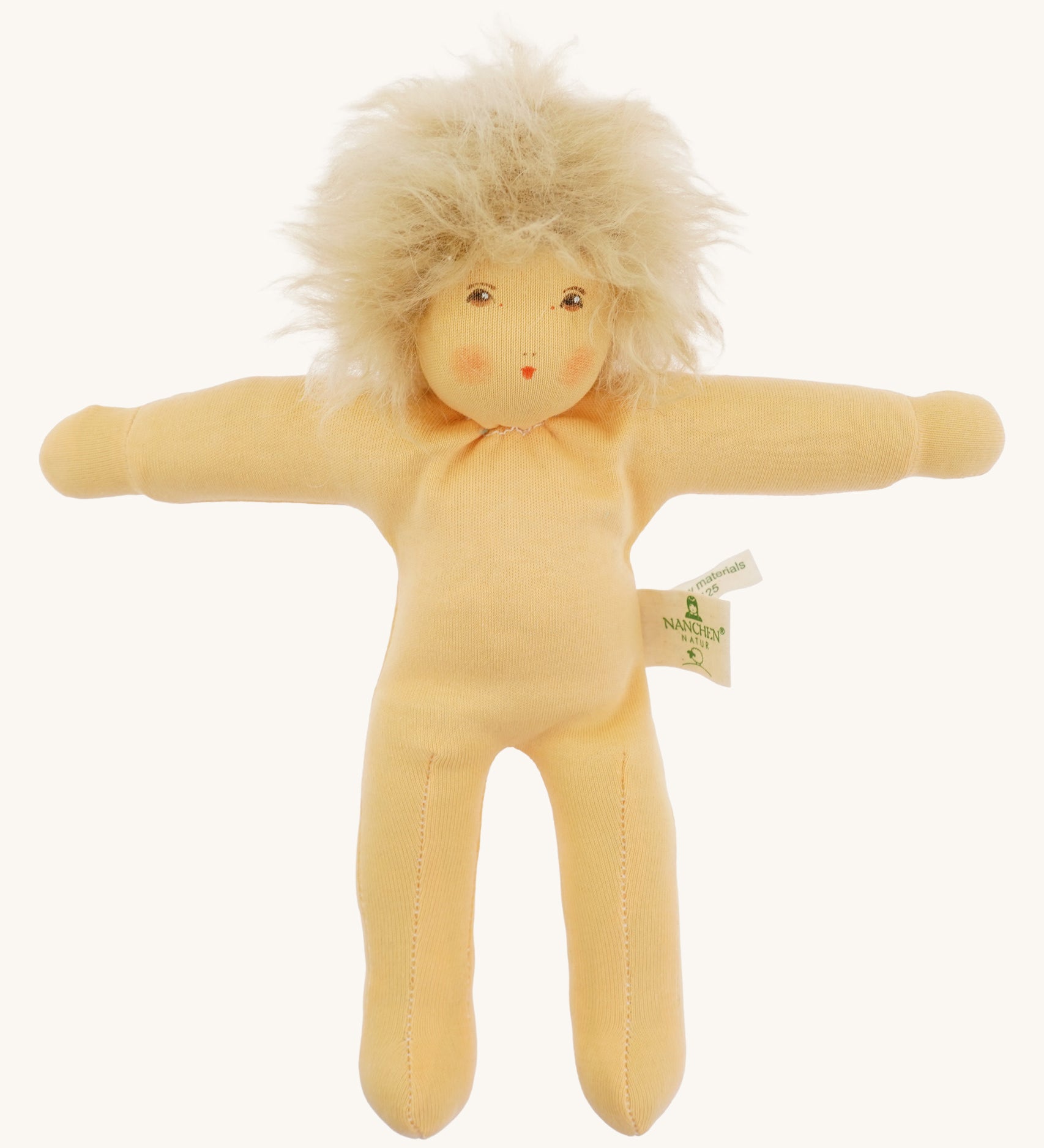 Front view of the Nanchen Frederik organic Waldorf doll with pale skin and fluffy blond mohair hair. The hand-painted face includes subtle blush and red lips. The doll is shown unclothed to highlight its handcrafted body.