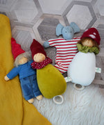 A collection of Nanchen organic soft toys. A Frederik Waldorf doll, Little red riding hood lullaby doll, elephant comforter and a toadstool lullaby doll. These heirloom quality toys are made in Germany from natural and organic materials, including Bioland-certified virgin sheep's wool and organic cotton.