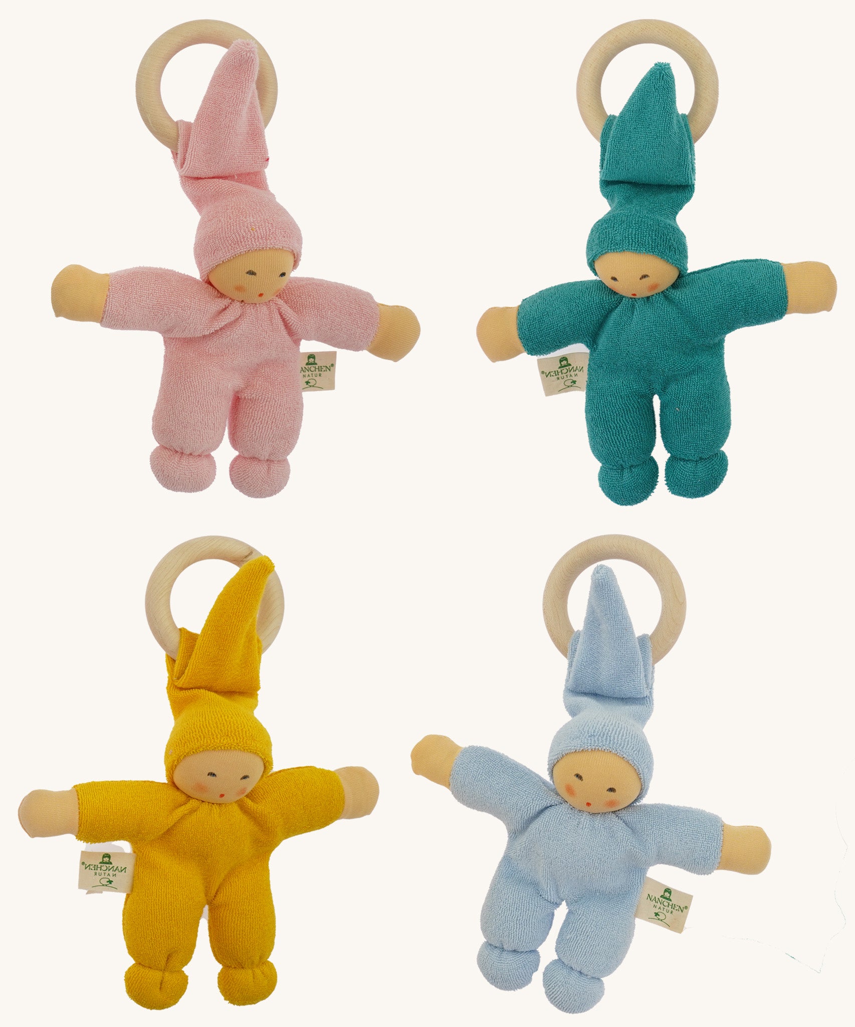 Four Nanchen Waldorf Pimpel Doll Baby Comforters arranged in a square. Each has a soft terry cotton body in pink, turquoise, yellow, or blue, a pointed hat, and an attached wooden teething ring. The dolls feature painted facial features and soft, knotted feet and hands.
