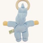 Back view of the blue Nanchen Pimpel Doll, showing the full cotton terry body with plump limbs and the wooden teething ring held through the tall soft hat.
