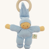 Front view of the Nanchen Pimpel Doll Baby Comforter in soft blue. The baby doll features softly painted facial details, a tall pointed hood, and a knotted footed design, with an attached wooden teething ring.