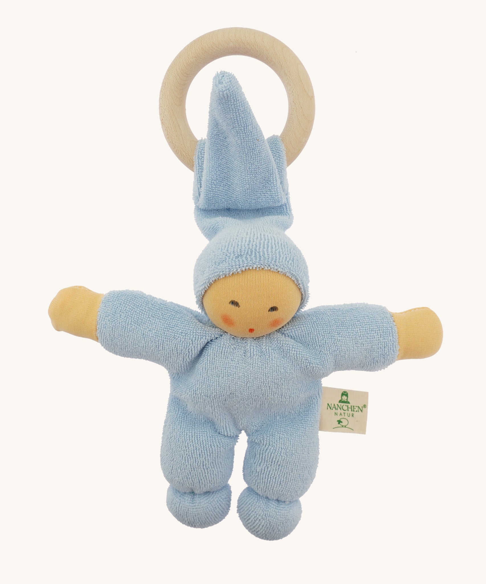 Front view of the Nanchen Pimpel Doll Baby Comforter in soft blue. The baby doll features softly painted facial details, a tall pointed hood, and a knotted footed design, with an attached wooden teething ring.
