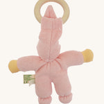 Back view of the pink Nanchen Pimpel Doll showing the soft texture of the organic cotton terry fabric, knotted feet, and the wooden teething ring looped through the pointed hat.