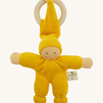 Front view of the Nanchen Pimpel Doll Baby Comforter in bright yellow, with a sweetly painted Waldorf-style face and wooden teething ring attached by its hat. The body and limbs are plush and rounded for cuddling.