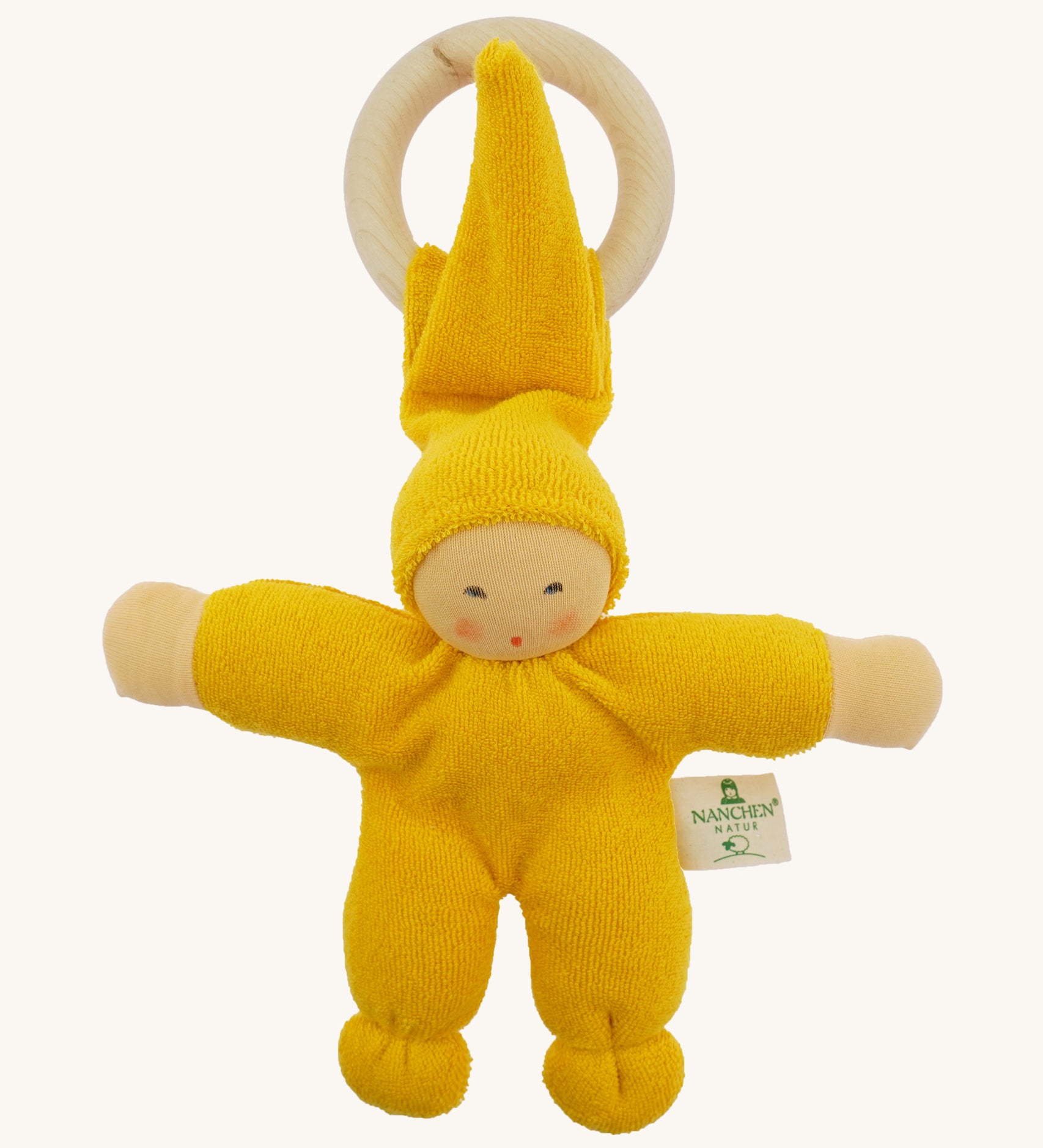 Front view of the Nanchen Pimpel Doll Baby Comforter in bright yellow, with a sweetly painted Waldorf-style face and wooden teething ring attached by its hat. The body and limbs are plush and rounded for cuddling.