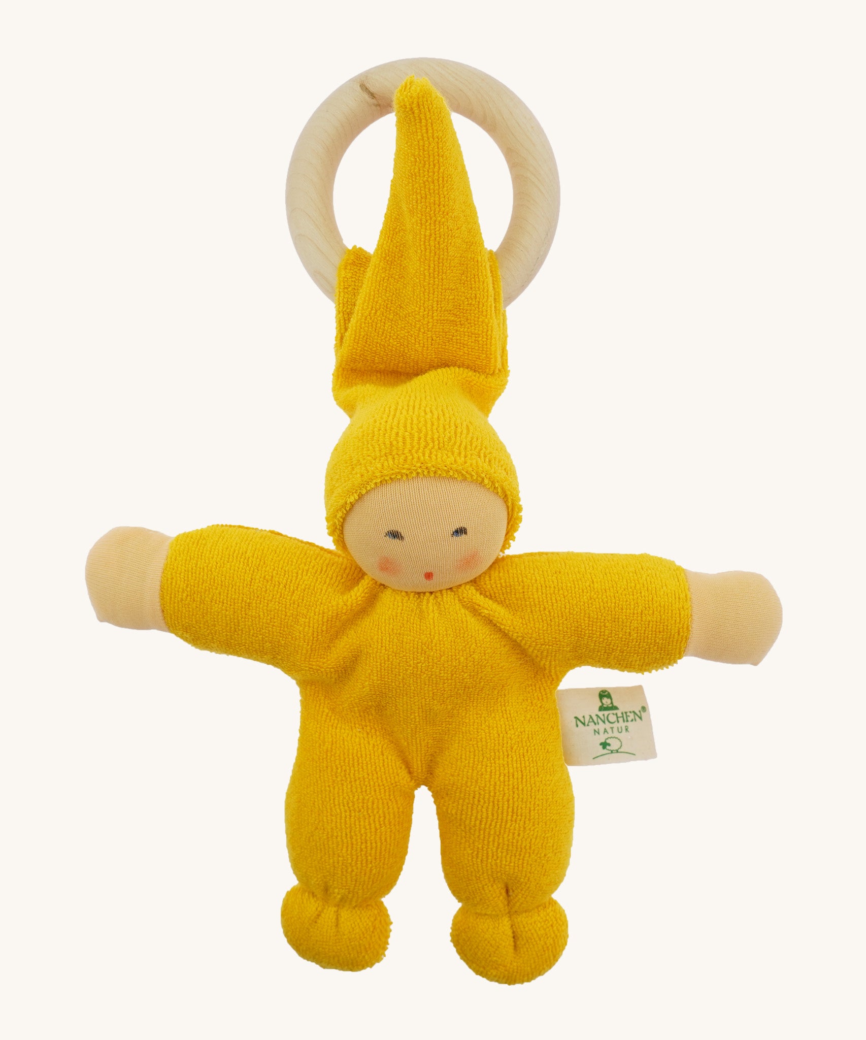 Front view of the Nanchen Pimpel Doll Baby Comforter in bright yellow, with a sweetly painted Waldorf-style face and wooden teething ring attached by its hat. The body and limbs are plush and rounded for cuddling.