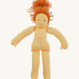 The Nanchen 'Flore' organic Waldorf doll, with her outfit taken off and curly red hair