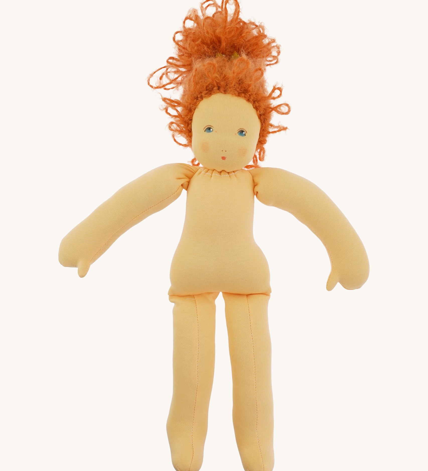 The Nanchen 'Flore' organic Waldorf doll, with her outfit taken off and curly red hair