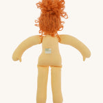 The back of Nanchen Flore doll without her clothes - an organic Waldorf doll with curly red hair