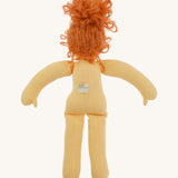 The back of Nanchen Flore doll without her clothes - an organic Waldorf doll with curly red hair