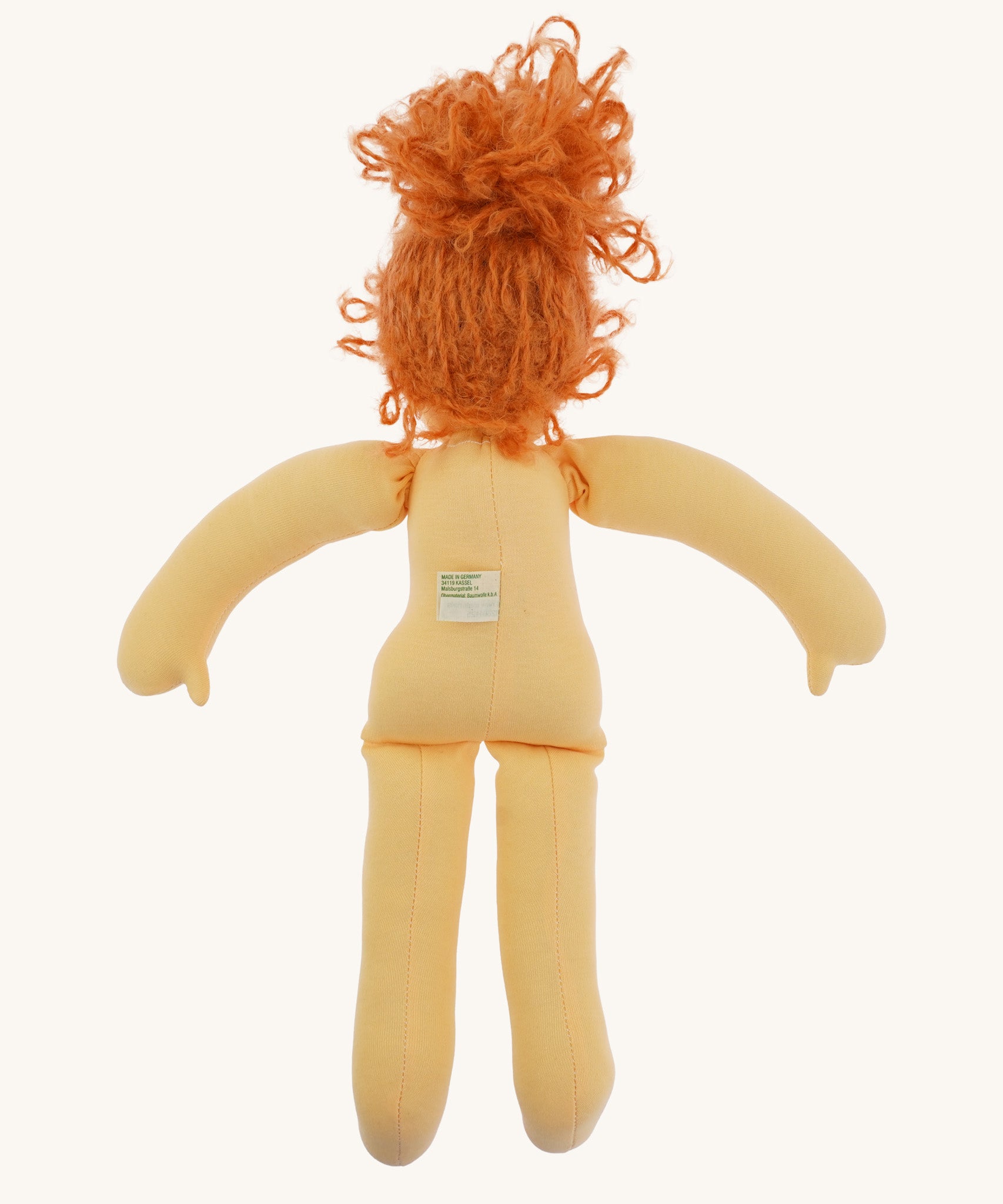 The back of Nanchen Flore doll without her clothes - an organic Waldorf doll with curly red hair