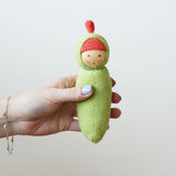 Nanchen Peapod Baby Rattle Doll being held in an adult's hand.