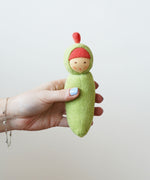 Nanchen Peapod Baby Rattle Doll being held in an adult's hand.