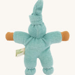 Back view of the Nanchen Pimpel Waldorf Doll in sage. The pointed hat is tied at the top, and the doll’s plush terry cotton body and arms are fully visible, along with a product tag at the side.
