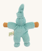 Back view of the Nanchen Pimpel Waldorf Doll in sage. The pointed hat is tied at the top, and the doll’s plush terry cotton body and arms are fully visible, along with a product tag at the side.
