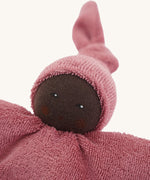 A close up of the face of the Nanchen Pimpel Waldorf Handcrafted Doll.  The small comforter doll is the perfect size for little hands to snuggle.