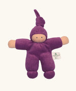 Nanchel pimpel waldorf doll in purple. Showing cute facial features and a tie on the hat. Doll has a terry cloth body 