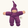 Nanchel pimpel waldorf doll in purple. Showing cute facial features and a tie on the hat. Doll has a terry cloth body 