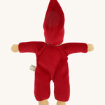 The back of the Nanchen Waldorf Nani Doll This hand crafted doll toy has a red fabric, soft body with a small white collar and red pointy hat. On a cream background