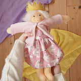 Nanchen Waldorf doll Rosi in an adult's hands in the Babipur playroom. 