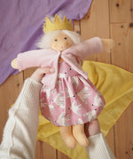Nanchen Waldorf doll Rosi in an adult's hands in the Babipur playroom. 