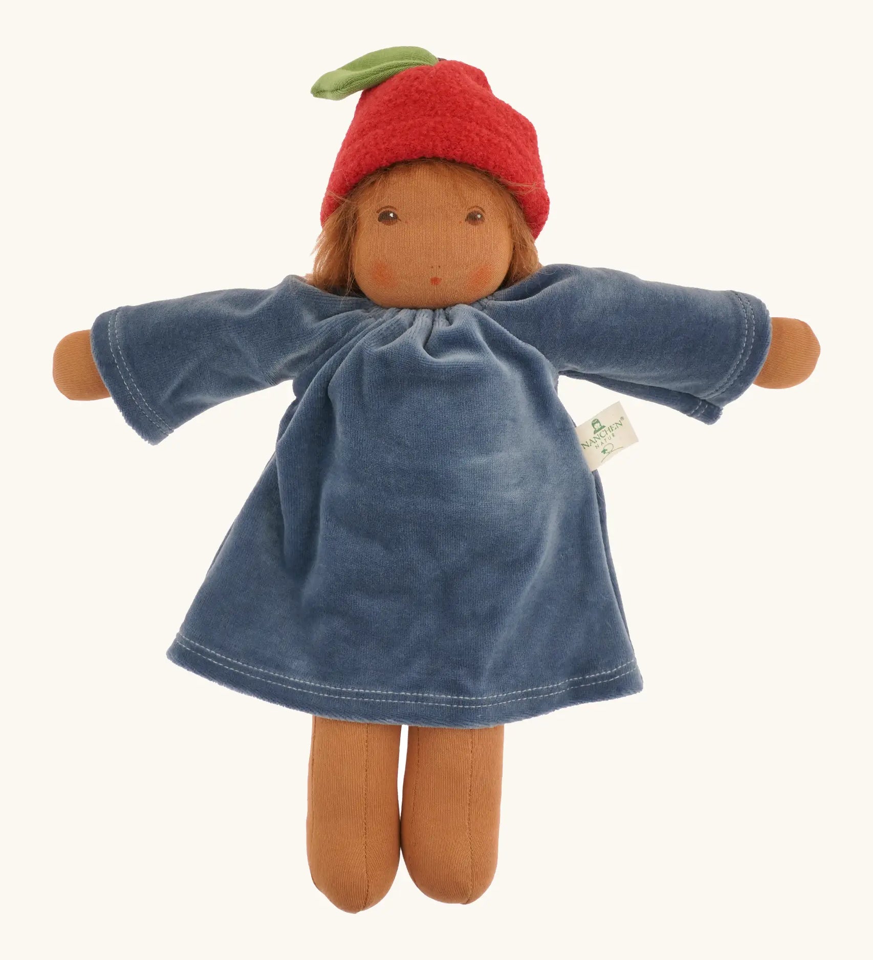 Nanchen Lenne garden child waldorf doll showing a blue terry cloth, long sleeve dress and red apple hat. 