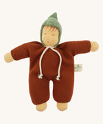 Front view of the Nanchen Waldorf Walnut Baby Doll. The doll wears a warm brown organic cotton terry suit with a green pointed hood and a white tie at the neck. Its soft face features hand-painted sleeping eyes, rosy cheeks, and a small pink mouth.