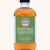 A 4oz bottle of the Natural Earth Paint natural varnish - enhances depth of color and protection 