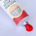 A close up of the scarlet red paint from Natural earth paint aluminium tube showing the consistency 