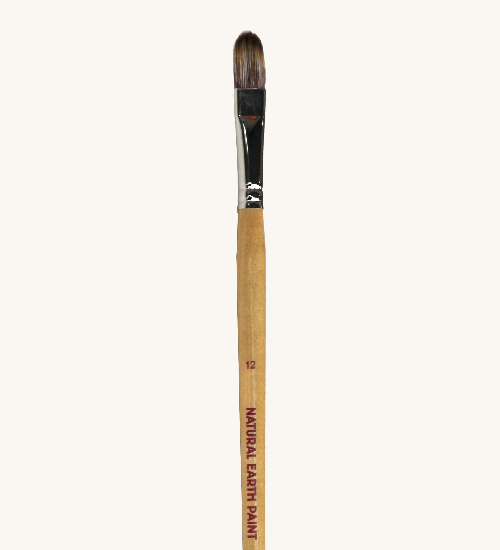 A close up view of the size 12 Natural Earth paint brush showing the wooden handle and brand name printed on the side