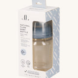 The Lola & Lykke Natural Flow Baby Bottle with cap, inside it's packaging. The packaging has a cut out so you can see the bottle inside