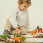 A child playing with the Oli Carol Rubber Cars