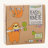 A close up of the cardboard box for the Neogrun modelling clay 4 pack showing the 2 playful sloth design 