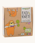 A close up of the cardboard box for the Neogrun modelling clay 4 pack showing the 2 playful sloth design 