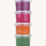 A vertical stack of the Neogrun organic play dough showing the green, orange pink and purple play dough in plastic tubs