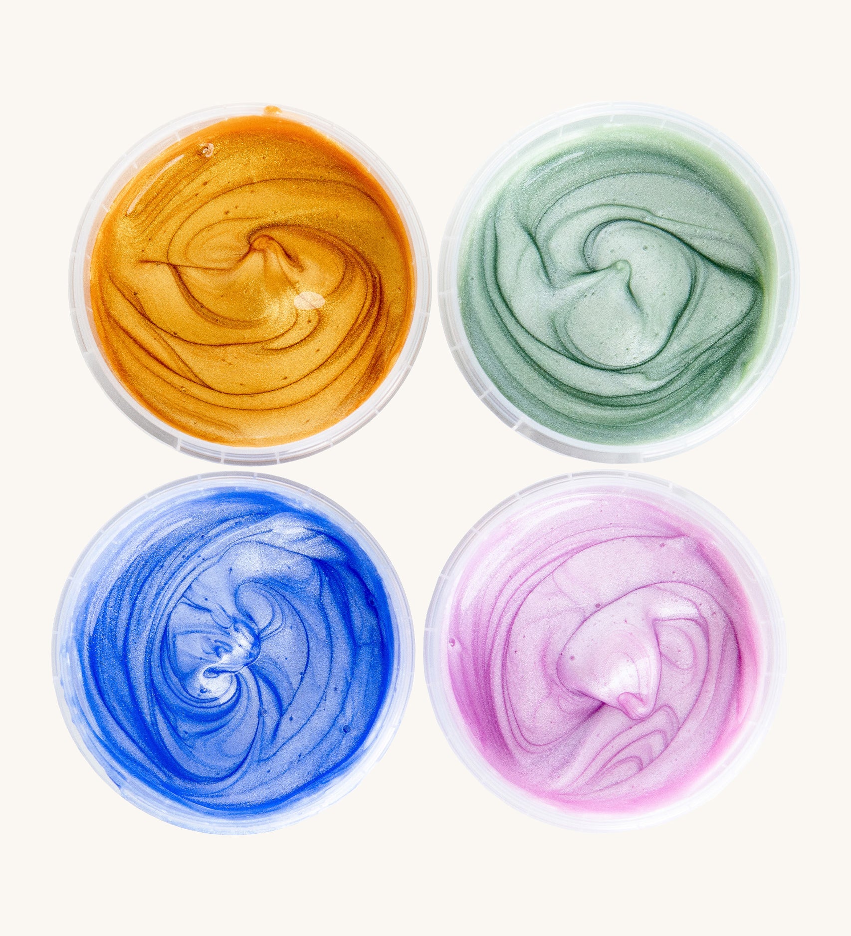A top down view of the Neogrun crystal finger paint. Showing the consistency of the  4 coloured glitter style finger paint 