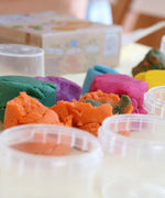 A close up of the orange, green and purple Neogrun play dough mixed together showing the texture and consistency