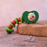 Nic apple worm baby wooden grasping toy. Smiling worm on a flexible rope lined with chunky red and green beads.