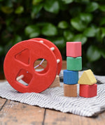 Nic BIO red rolling shape sorter wooden toy with 6 wooden blocks. 
