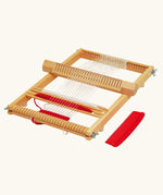 Nic Ines Weaving Frame pictured with red and white yarn. 