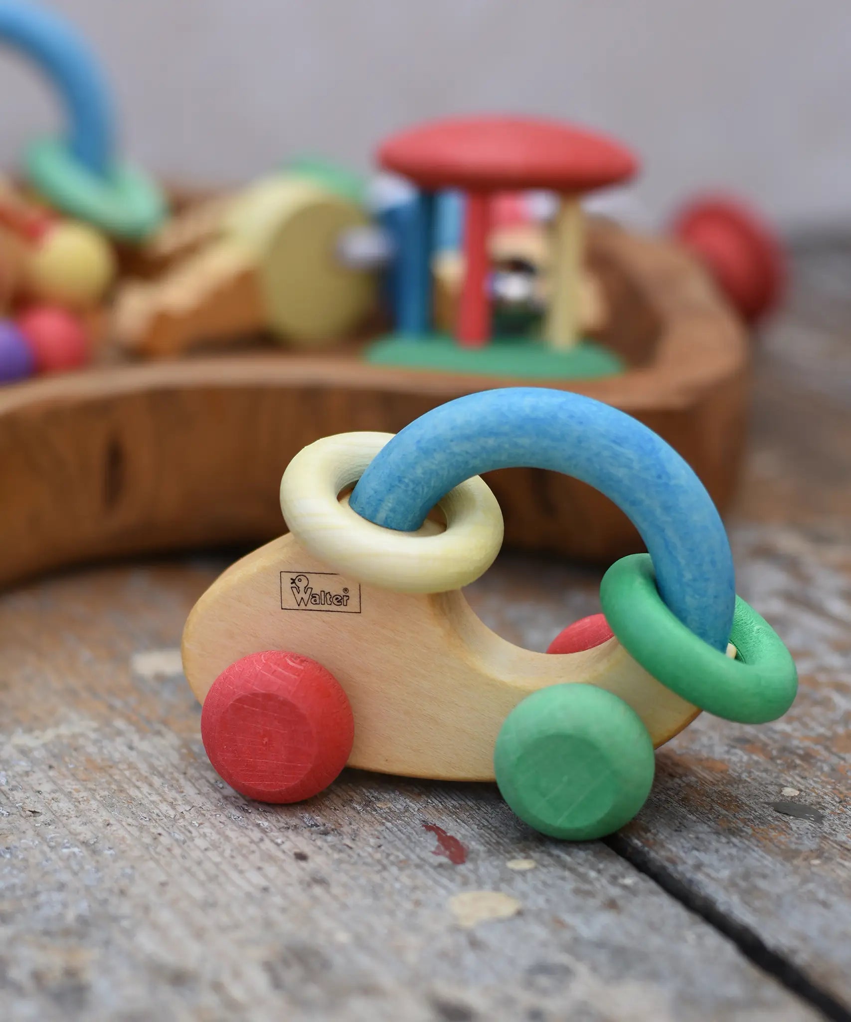Nic organic grip car wooden baby toy placed on a wooden surface.